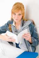 Student young happy woman portrait with book