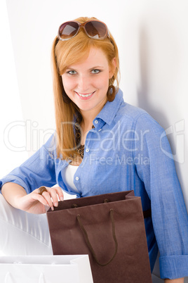 Shopping young woman with paper bag