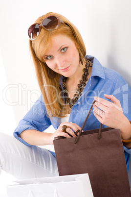 Shopping young woman with paper bag