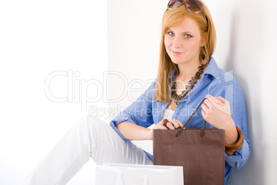 Shopping young woman with paper bag