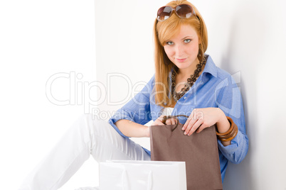 Shopping young woman with paper bag