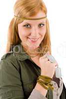 Hippie young woman in khaki outfit hold dog-tag