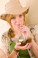 Safari young woman drink straw coconut