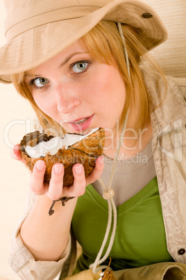 Safari happy young woman drink coconut