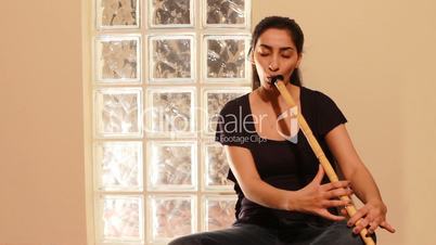 young woman playing flute