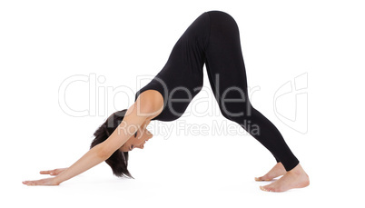 woman stand in yoga asana - Downward Facing Dog