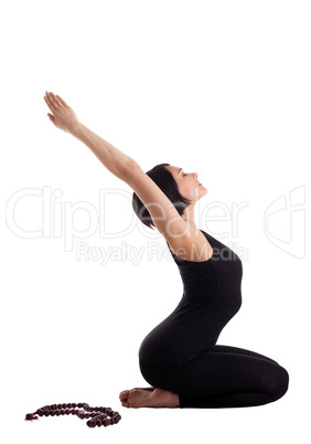 Young woman sit in yoga asana with beads