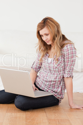 Concentrated woman surfing on her laptop