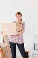 Blonde woman carrying cardboard boxes