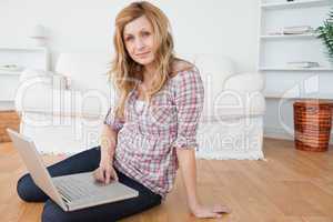 Cute woman surfing on her laptop