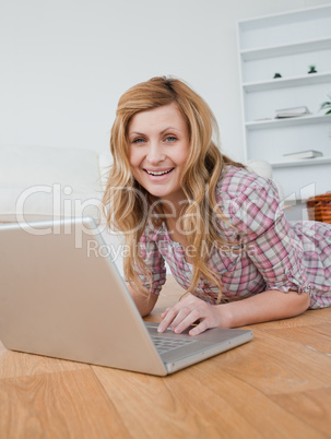 Blonde woman chatting on her laptop