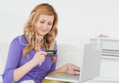 Attractive woman sitting on a sofa