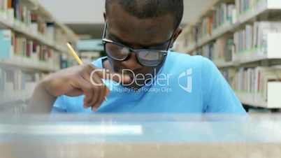 Young black man studying in library