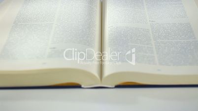 Bible Book scrolling by hand