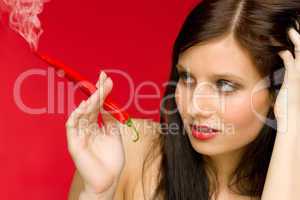 Chili pepper portrait young woman smoke red hot