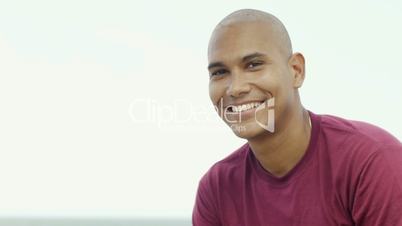 Young latino man smiling at camera