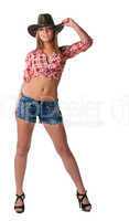 Beautiful sexy cowgirl stand in shorts isolated