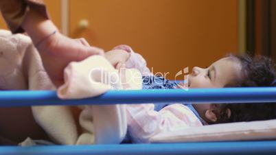 Baby girl in bed at school