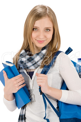 Student teenager woman with schoolbag hold books