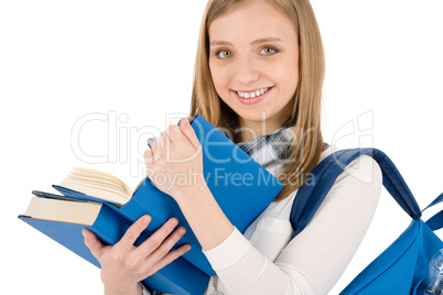 Student teenager woman with schoolbag hold books