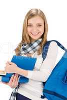 Student teenager woman with schoolbag hold books