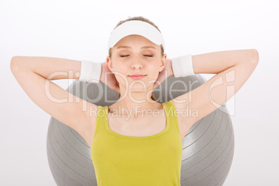 Fitness teenager woman with closed eyes