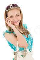 Teenager woman with mobile phone in summer
