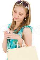 Shopping teenager woman with mobile phone