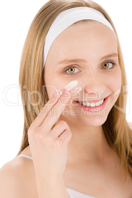 Facial care teenager woman apply cream