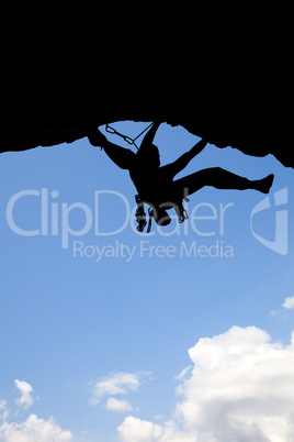 Rock climber silhouette in a sunny day