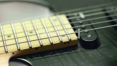 Detail of electric guitar, pickups and cords
