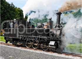 Historical steam engine on tracks near Mauterndorf railway station in Austria