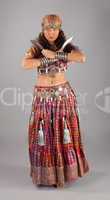 Oriental indian dancer with knifes