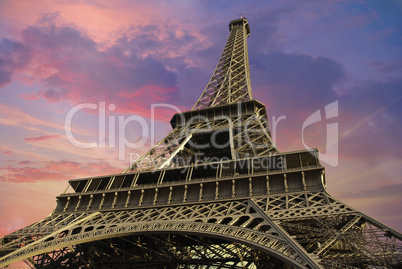 Eiffel Tower at Sunset against a Cloudy Sky