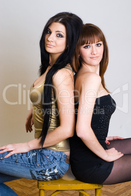 Two beautiful women posing together