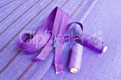 Locking zipper and thread on the purple fabric