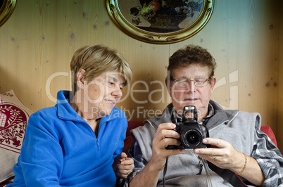 Senior Couple wathcing Pictures on the Camera
