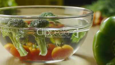 Tomatoes, broccoli and vegetables on kitchen table