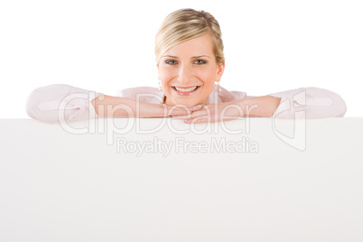 Businesswoman leaning over empty banner