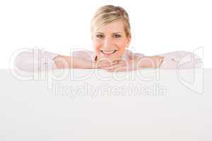 Businesswoman leaning over empty banner