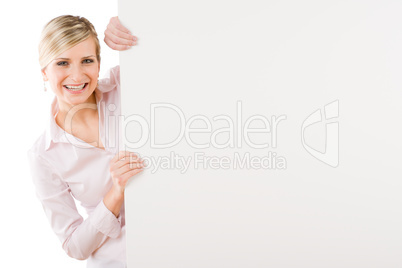 Happy businesswoman behind empty banner landscape