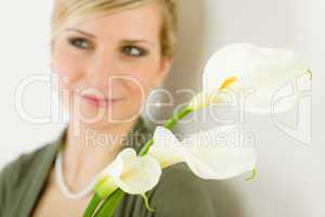 Portrait of calla lily flower woman in background