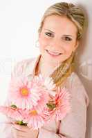Romantic woman hold pink gerbera daisy