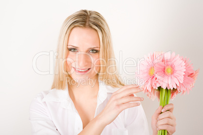 Romantic woman hold pink gerbera daisy flower