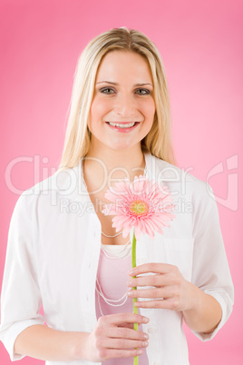 Romantic woman hold pink gerbera daisy flower