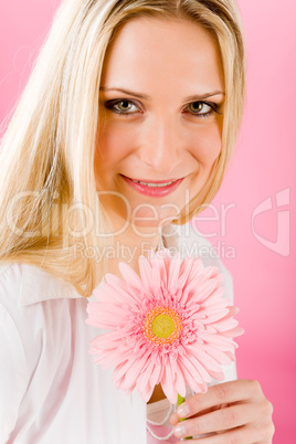 Romantic woman hold pink gerbera daisy flower