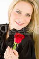 Elegant woman hold red rose