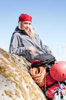 Active woman rock climbing relax with backpack