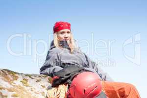 Active woman rock climbing relax with backpack
