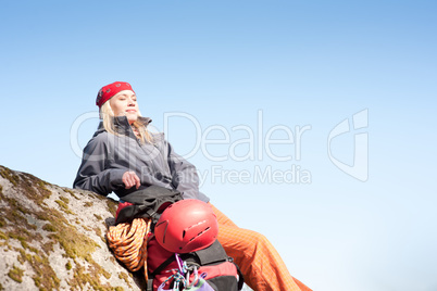 Active woman rock climbing relax with backpack